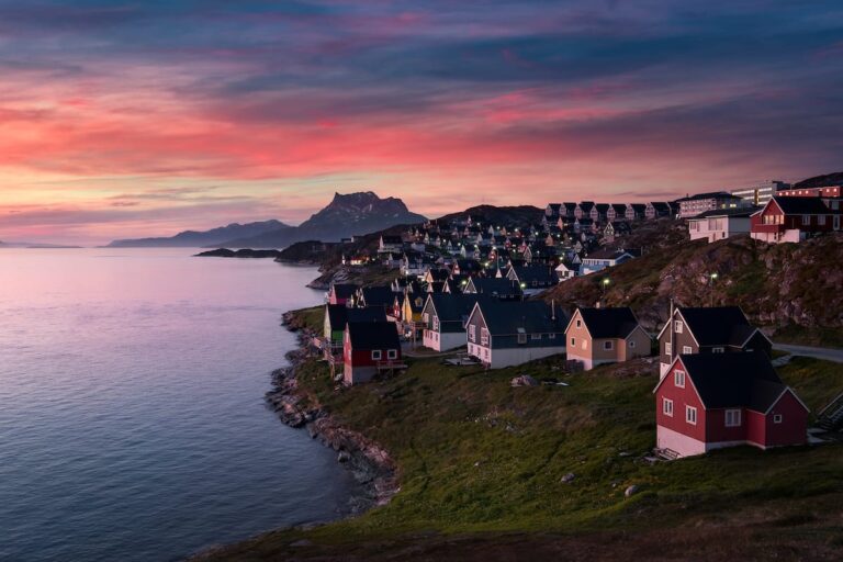 Colorful houses by the serene coast in Nuuk Greenland